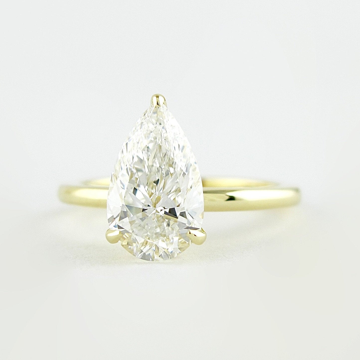 1.5 CT Pear Cut Solitaire Style Moissanite Engagement Ring