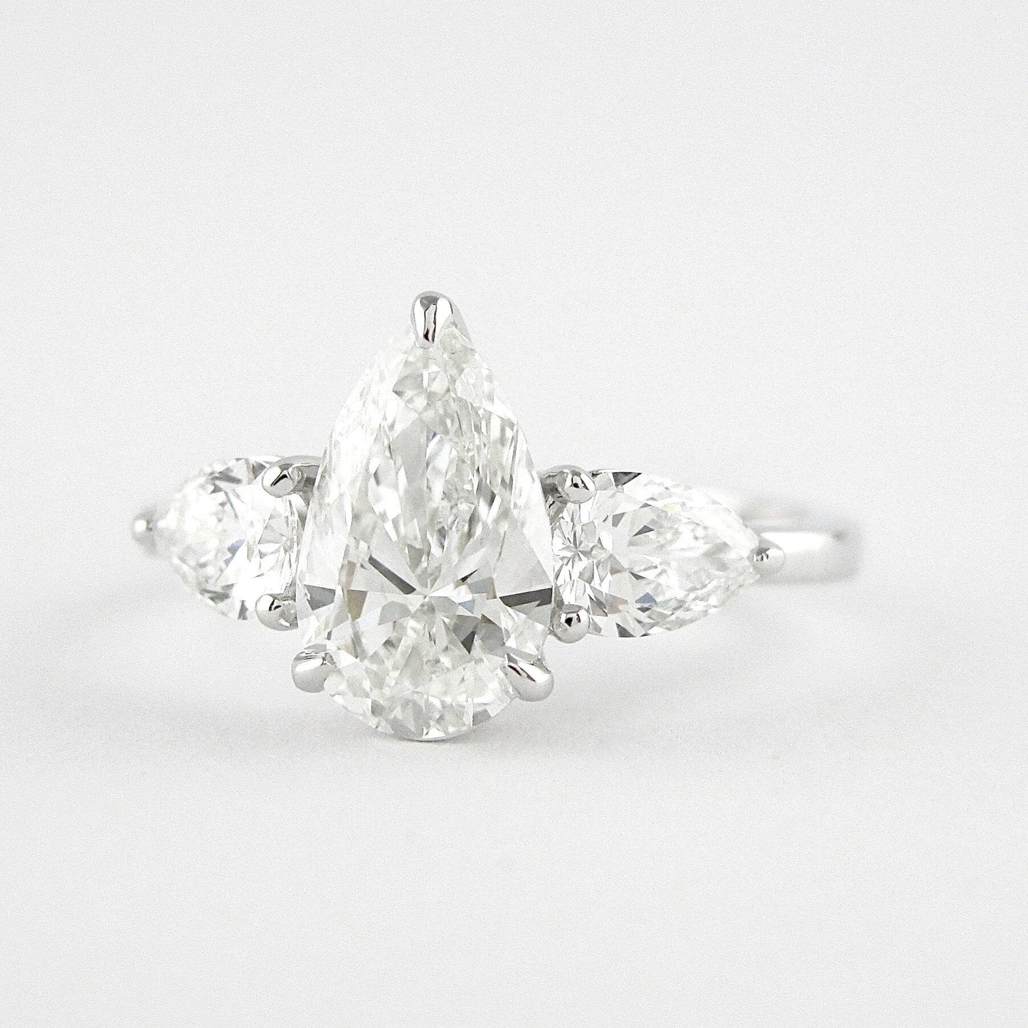 1.50 CT Pear Cut Three Stone Style Moissanite Engagement Ring