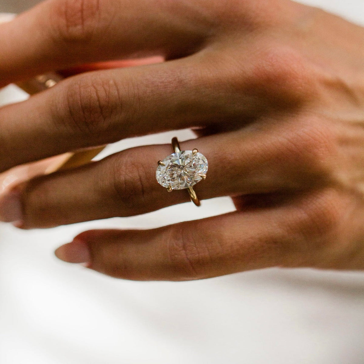Oval Shaped Lab Grown Diamond Hidden Halo Engagement Ring