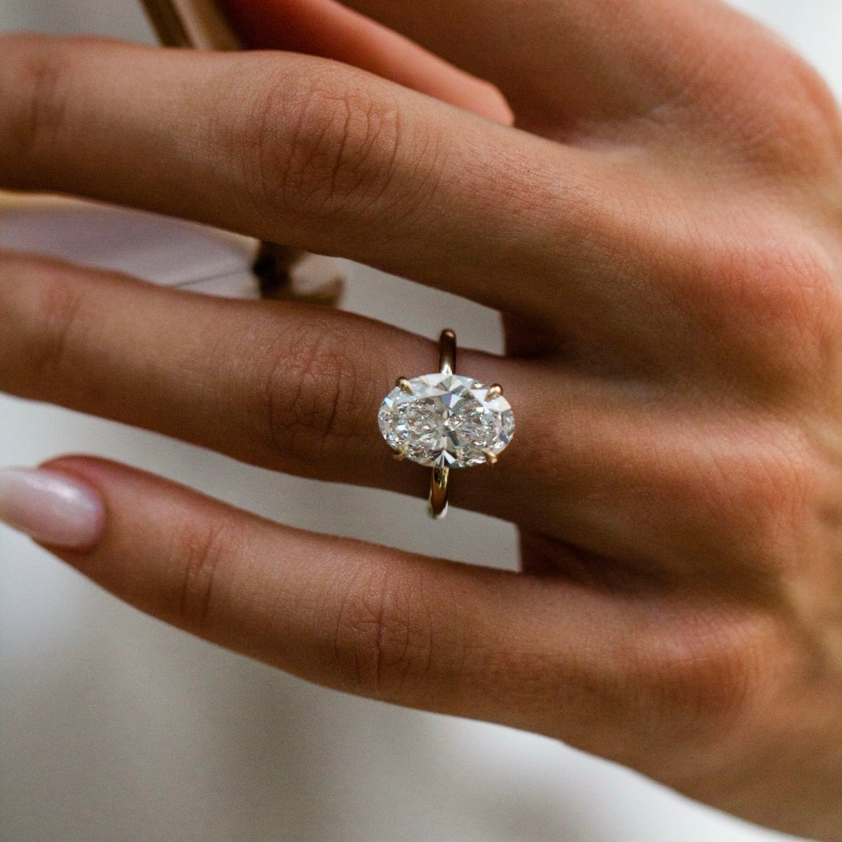 Oval Shaped Lab Grown Diamond Hidden Halo Engagement Ring