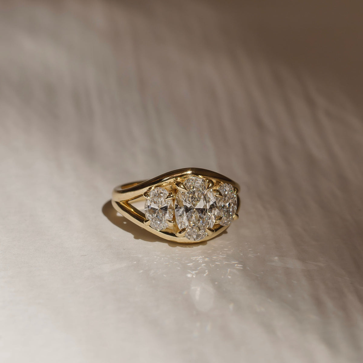 2.5 CT Oval: Three Stone Split Shank Lab Grown Diamond