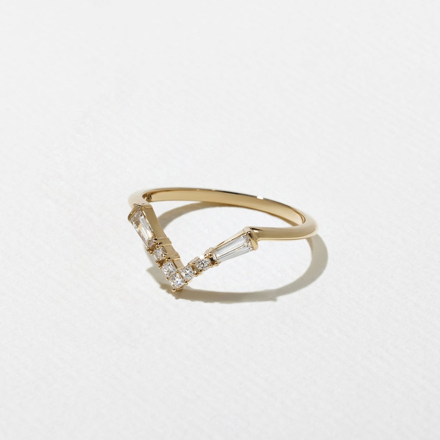 0.25 TCW Round, Tapered baguette & Princess- V Shape Wedding Band