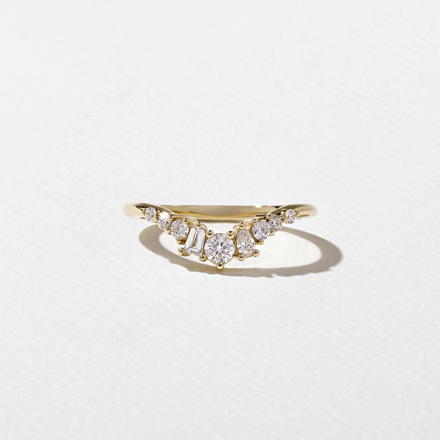 0.34 TCW Round, Tapered baguette & Pear- Curved Wedding Band
