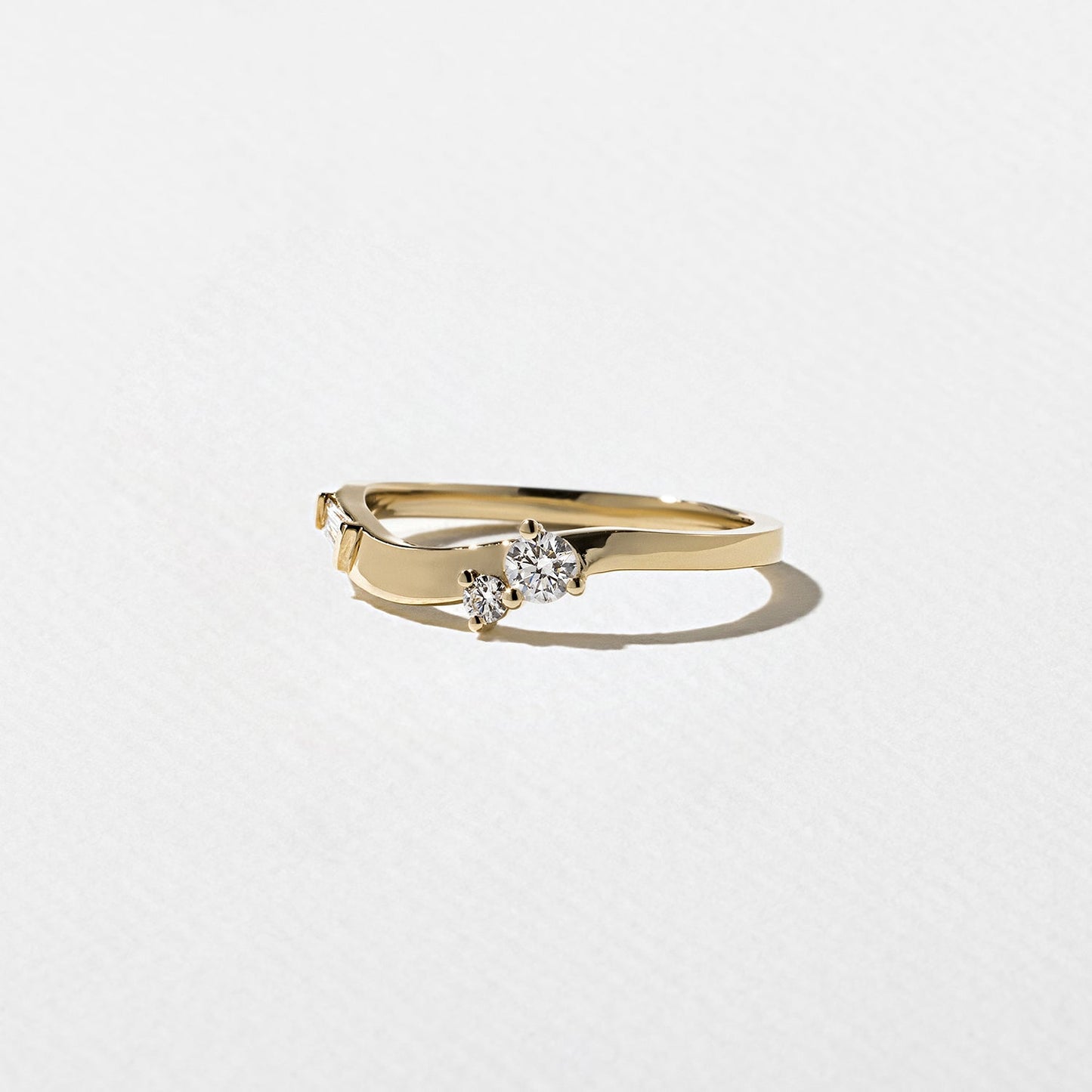 0.23 TCW Round, Tapered Baguette, and Pear unique Wedding Band