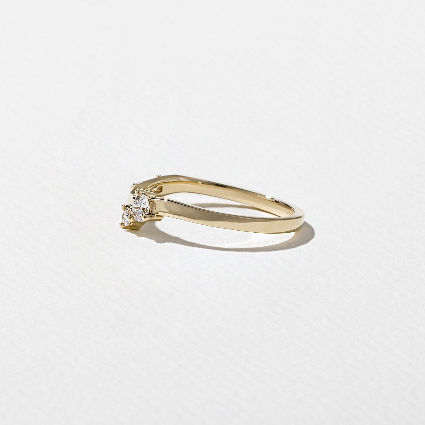 0.23 TCW Round, Tapered Baguette, and Pear unique Wedding Band
